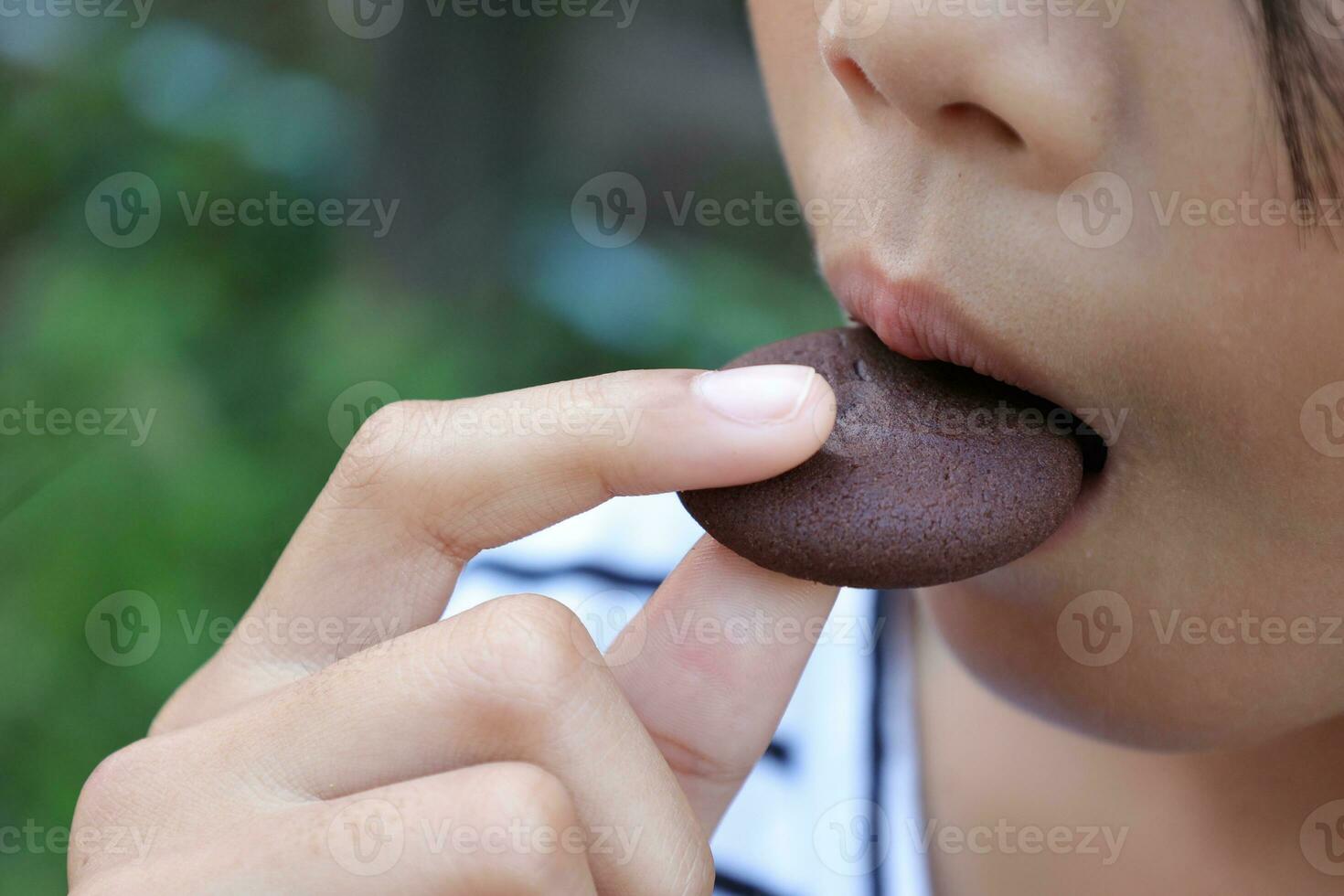 Close-up view of mouth eating food photo