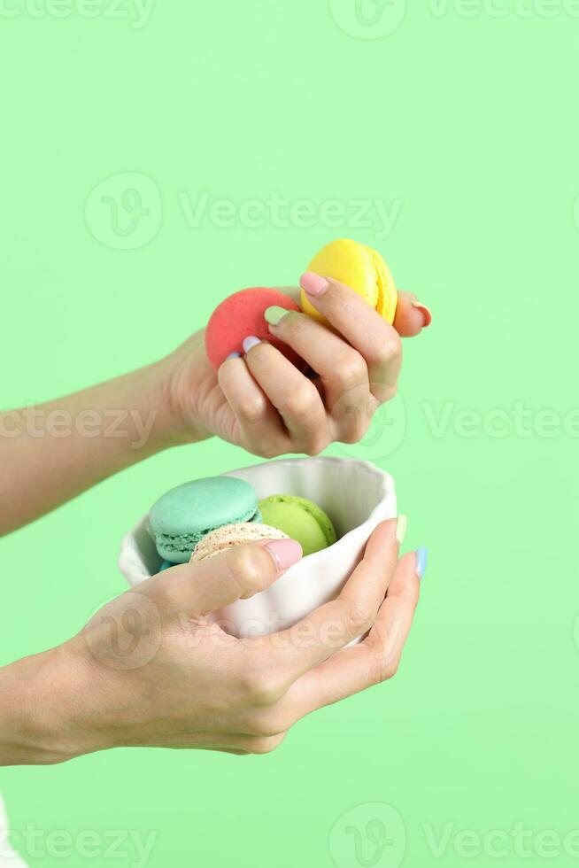 Hand with Macaroons photo