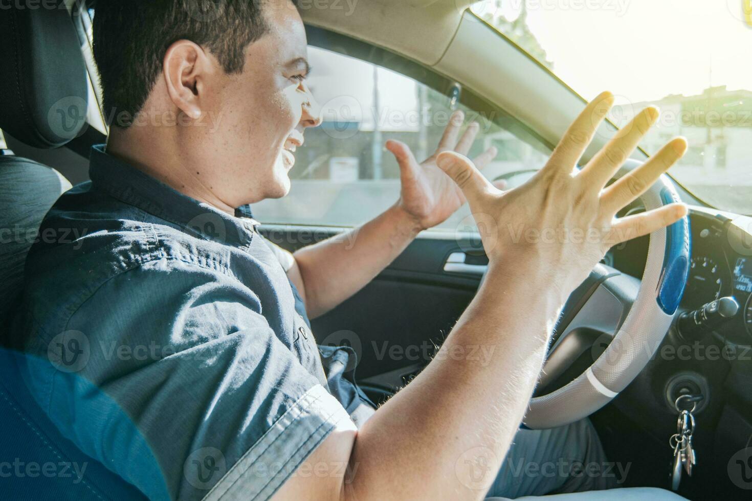 Impatient driver yelling, portrait of angry driver yelling in his car, stressed driver man yelling at other driver, concept of impatient driver yelling photo