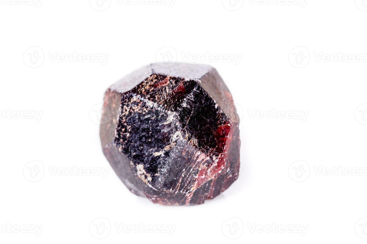 Macro of a mineral garnet stone on a white background photo