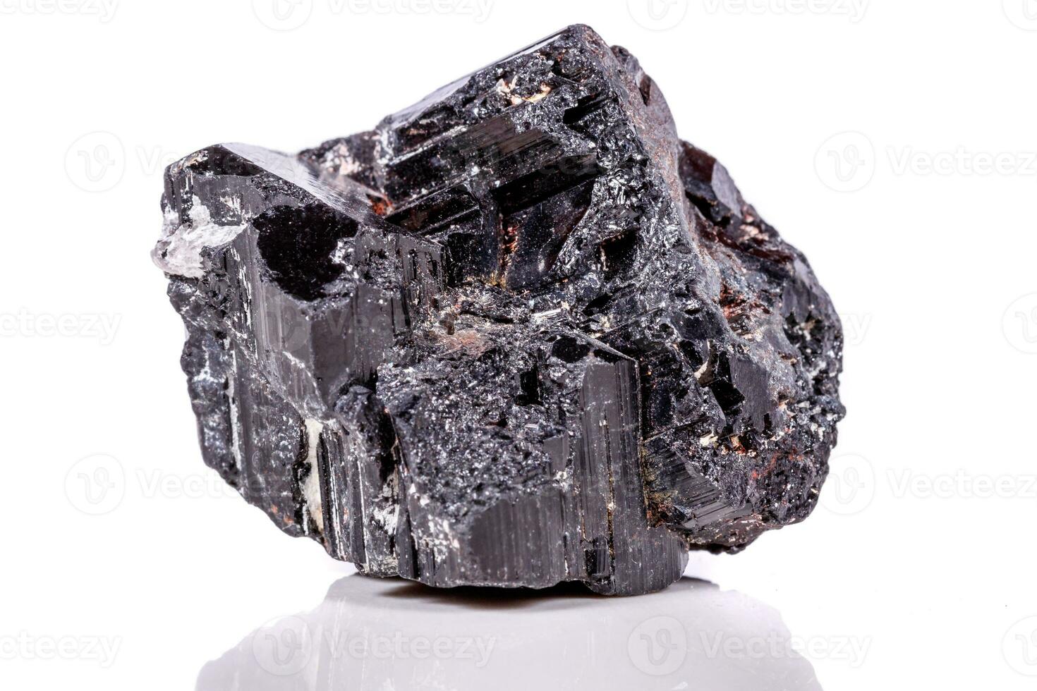 macro mineral stone sherle, schorl, black tourmaline on white background photo