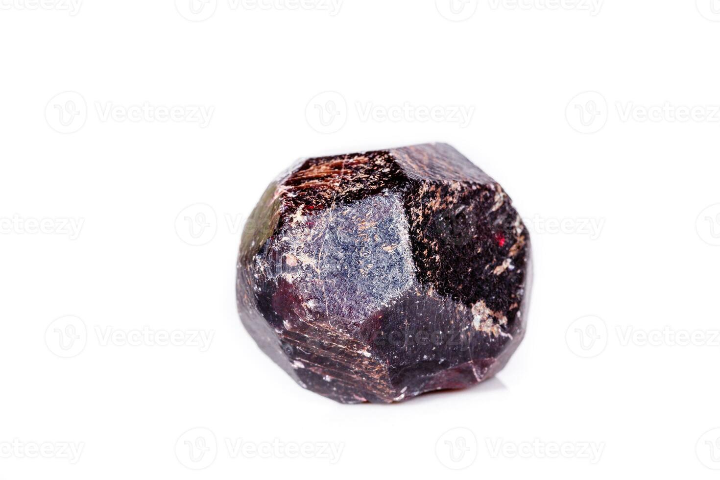 Macro of a mineral garnet stone on a white background photo