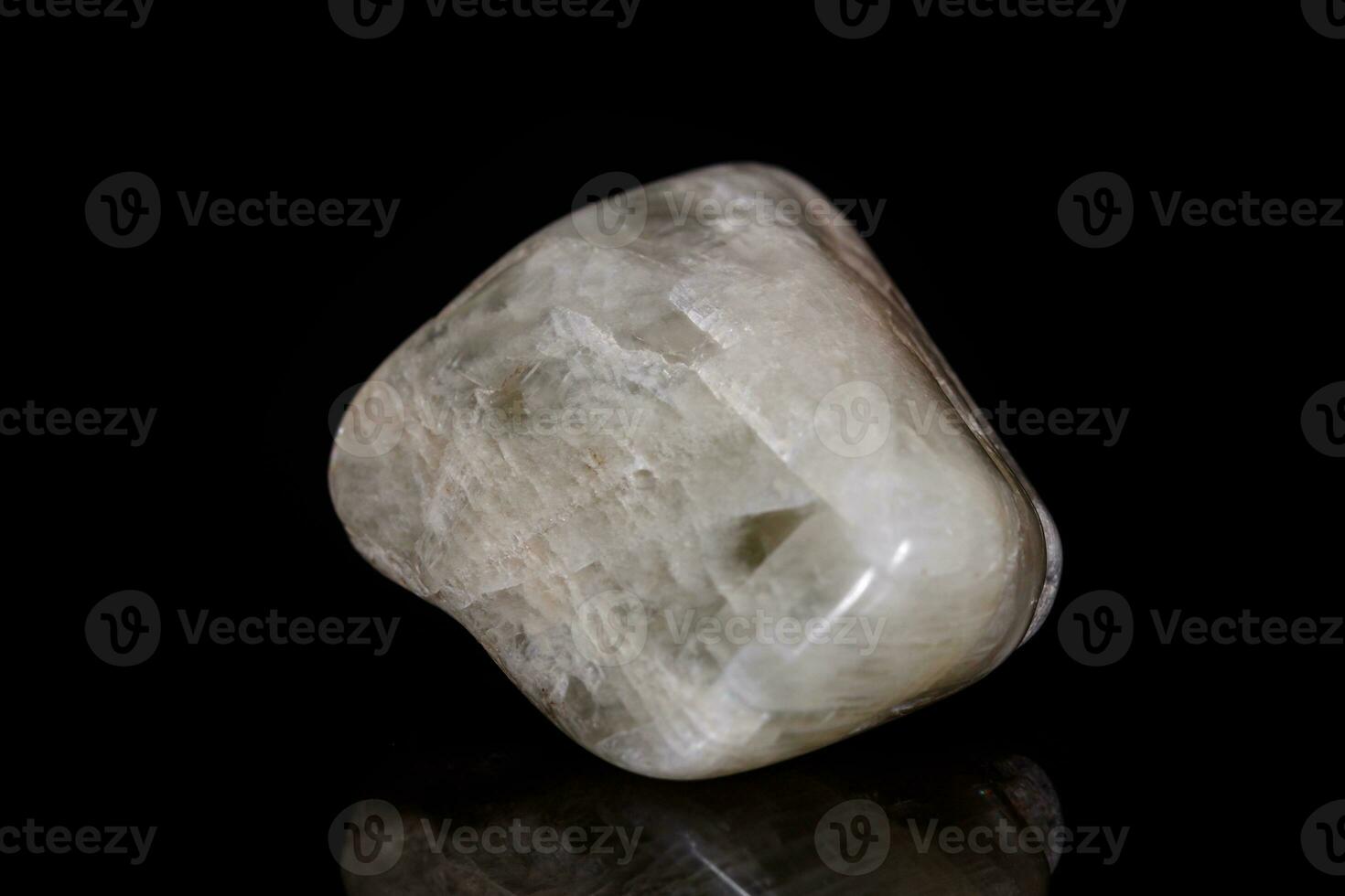 Macro mineral stone Moonstone on black background photo