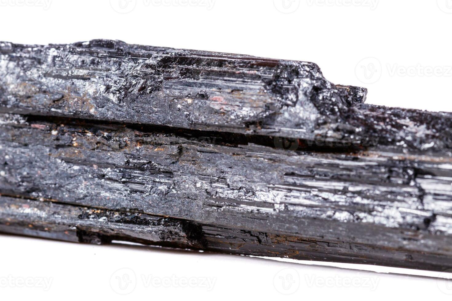 macro mineral stone sherle, schorl, black tourmaline on white background photo