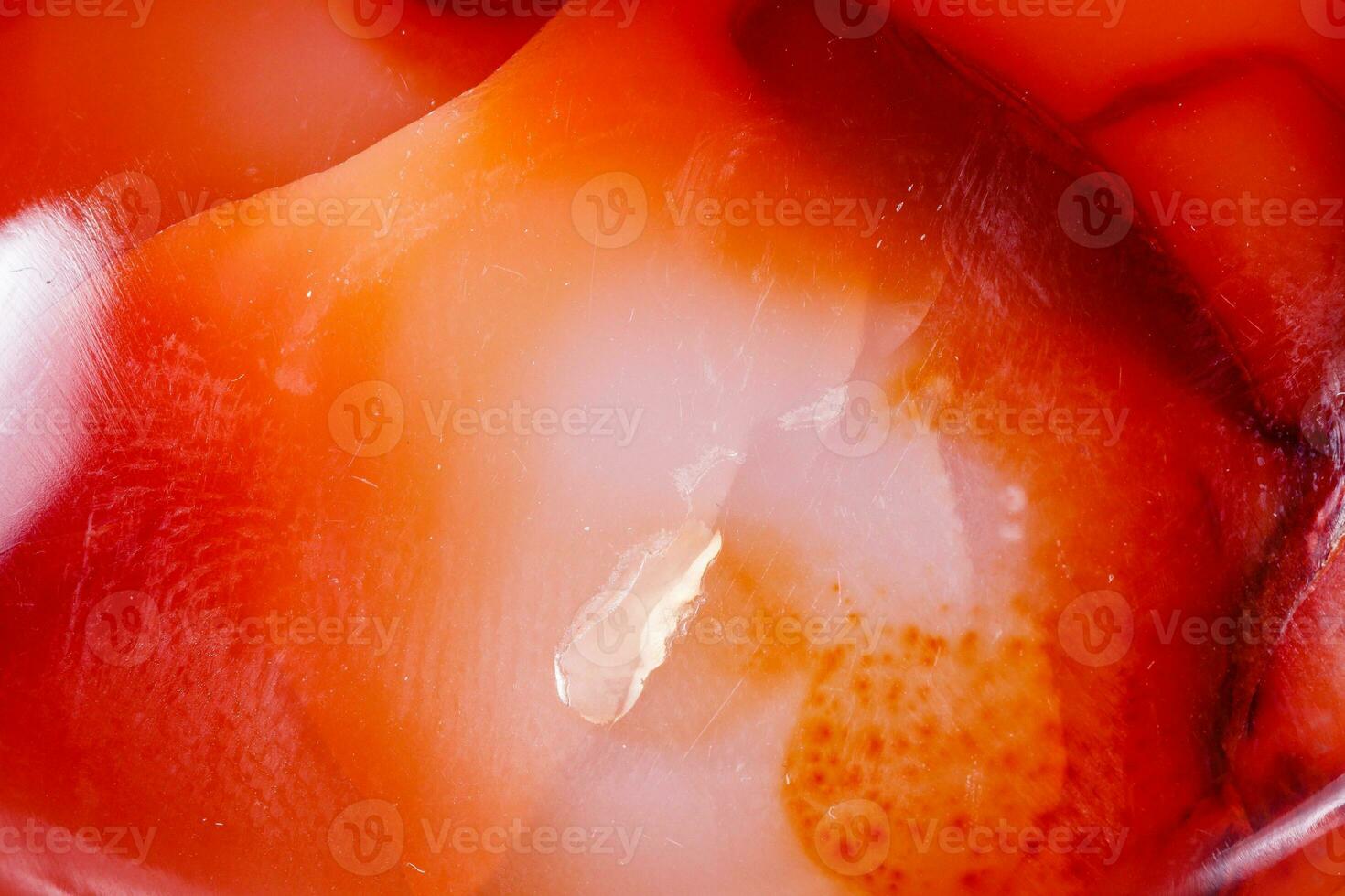 Macro mineral stone Carnelian on white background photo