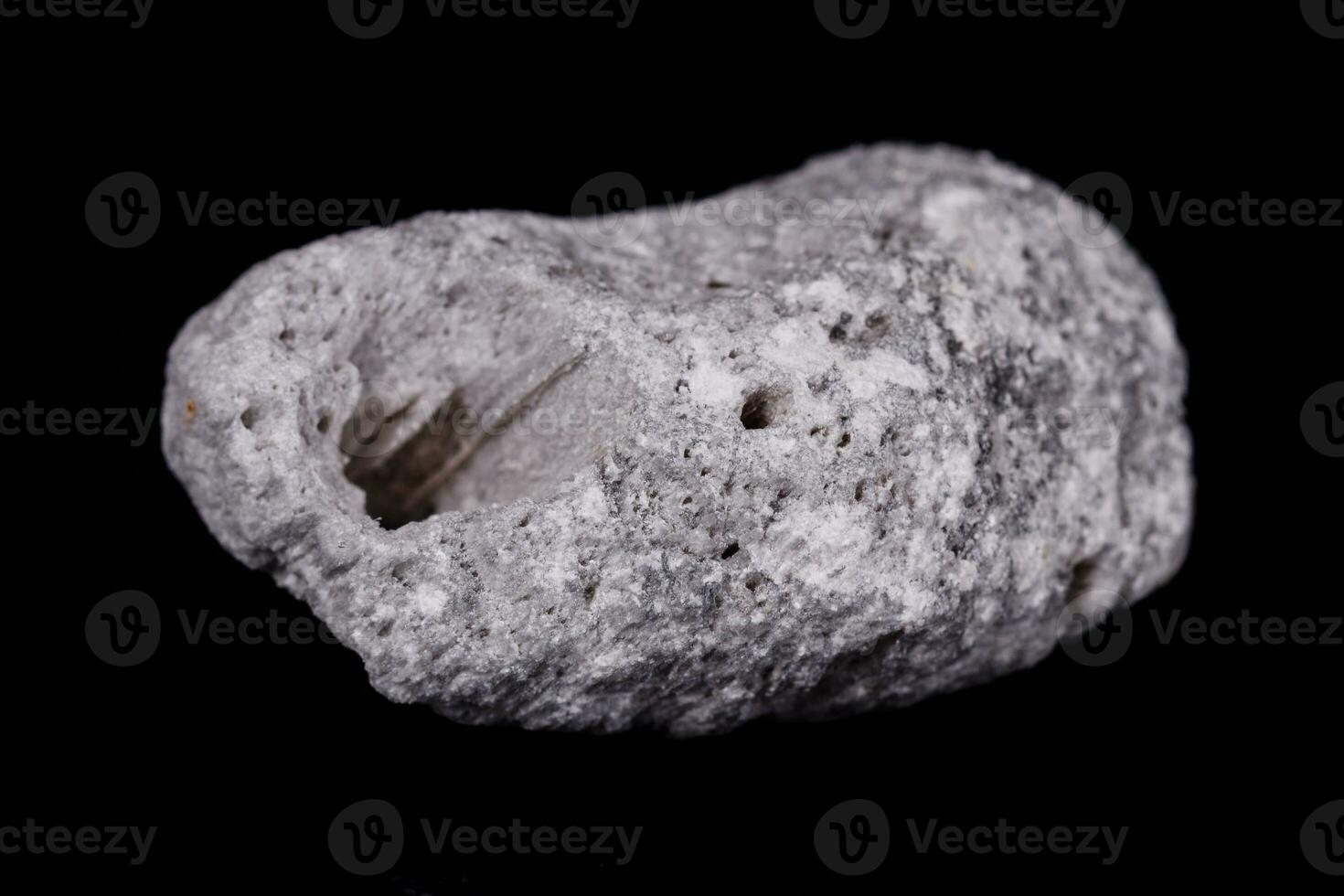 Macro mineral stone Pumice on black background photo