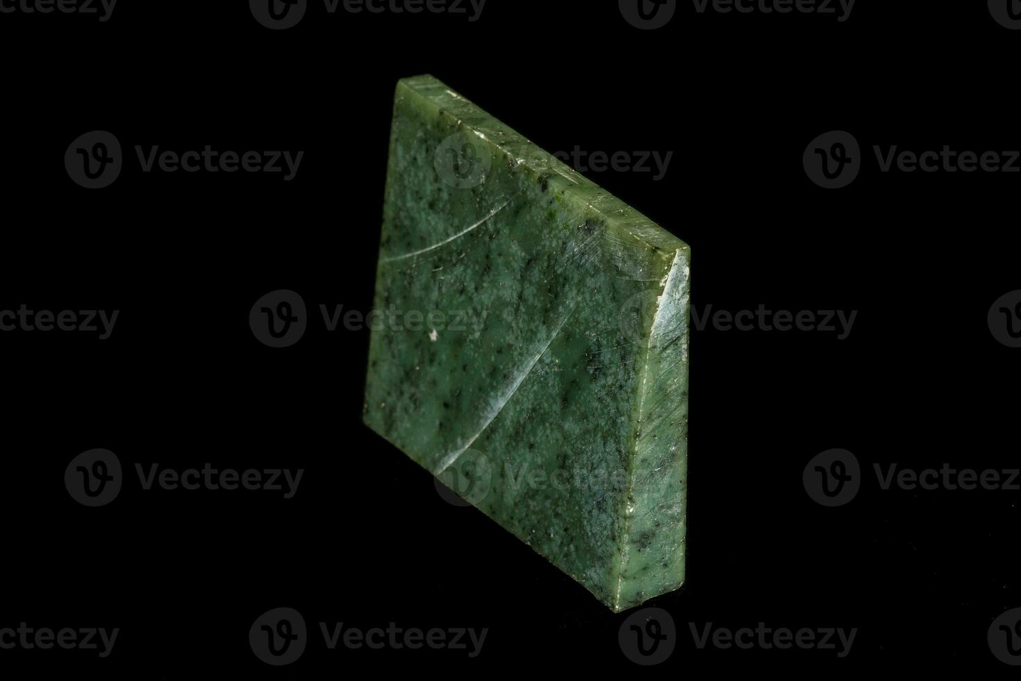 Nephrite mineral stone macro on a black background photo