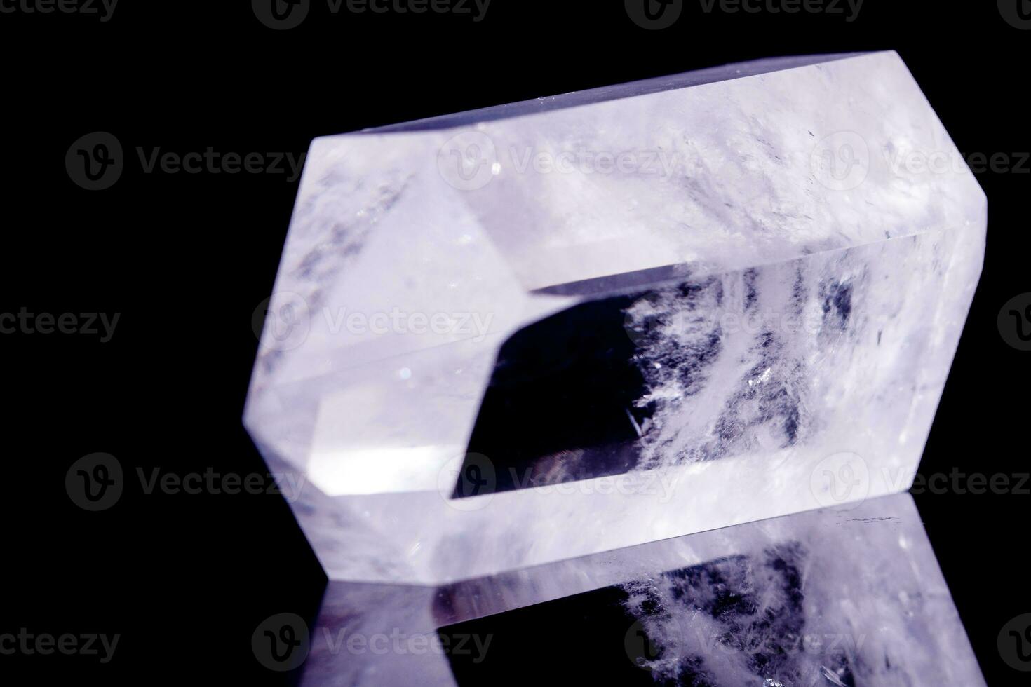 Macro mineral stone Crystal rock crystal on a black background photo