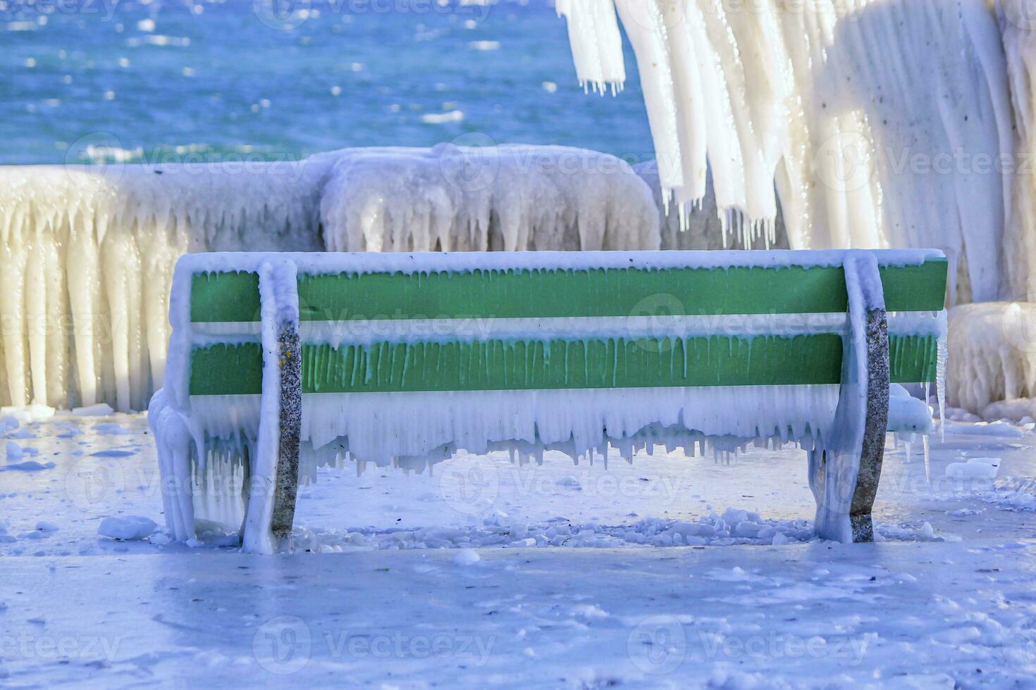 Frozen bench by very cold winter, Versoix, Switzerland photo