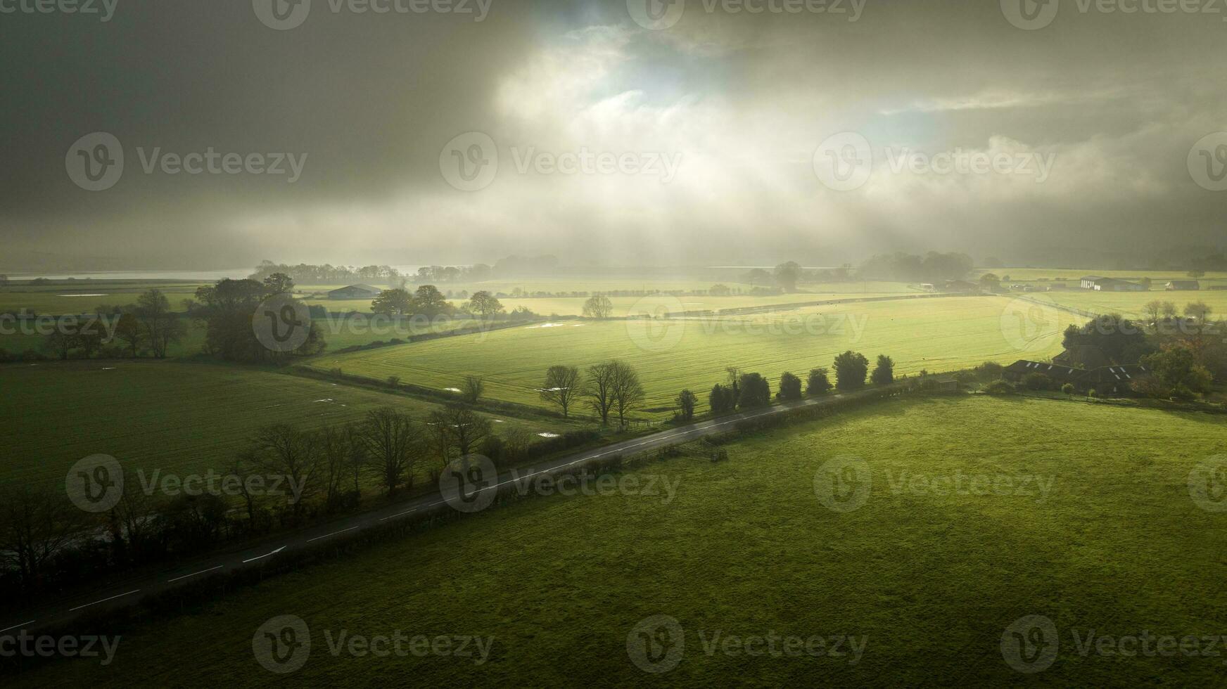 Misty morning over flooded fields by Pulborough, west sussex, uk photo