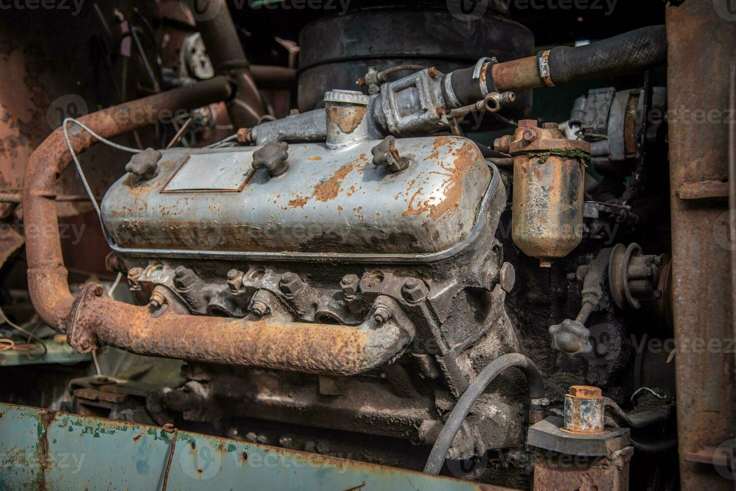 Old diesel engine on agricultural machine photo