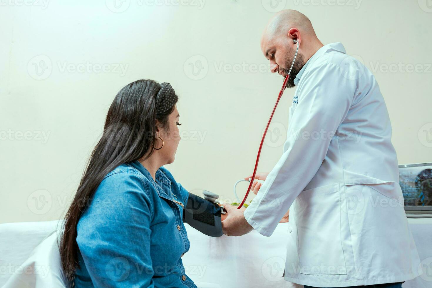 Measuring blood pressure to patient in the office, Nutritionist man measuring blood pressure to female patient in office, Nutritionist measuring blood pressure to patient photo