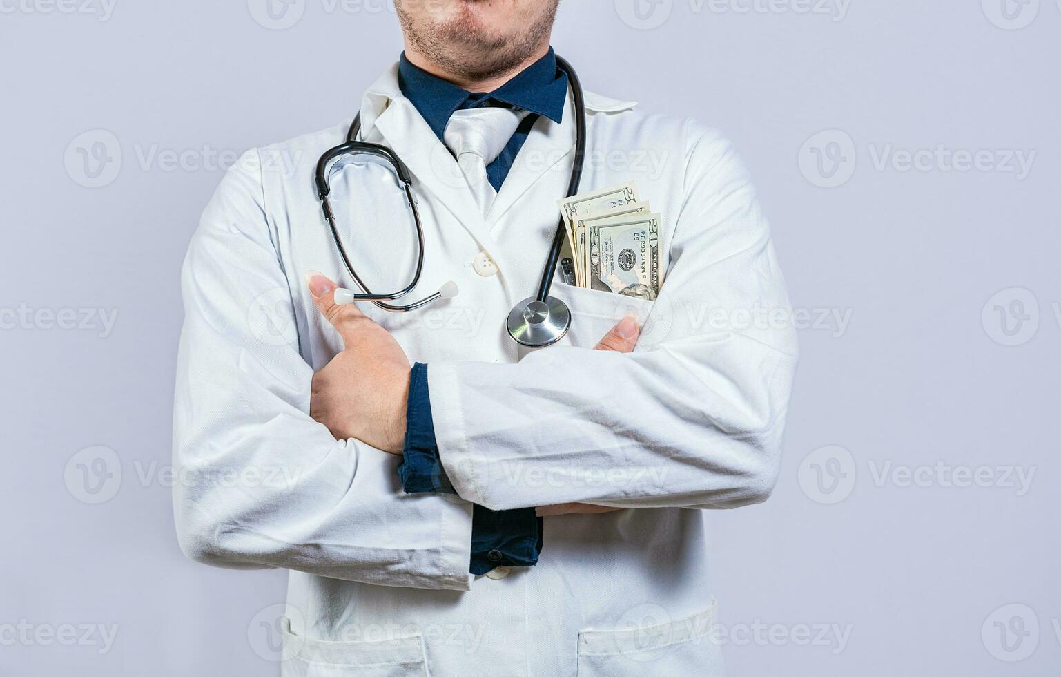 Medical bribery concept. Bribed doctor with money in pocket isolated. Corrupt doctor with bribe money in pocket isolated photo