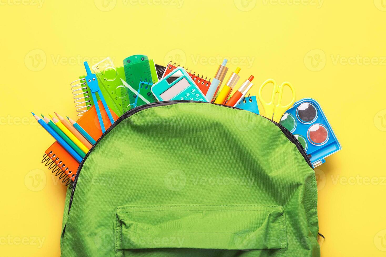 Top view of school backpack and school supplies with space for text. Back to school concept photo