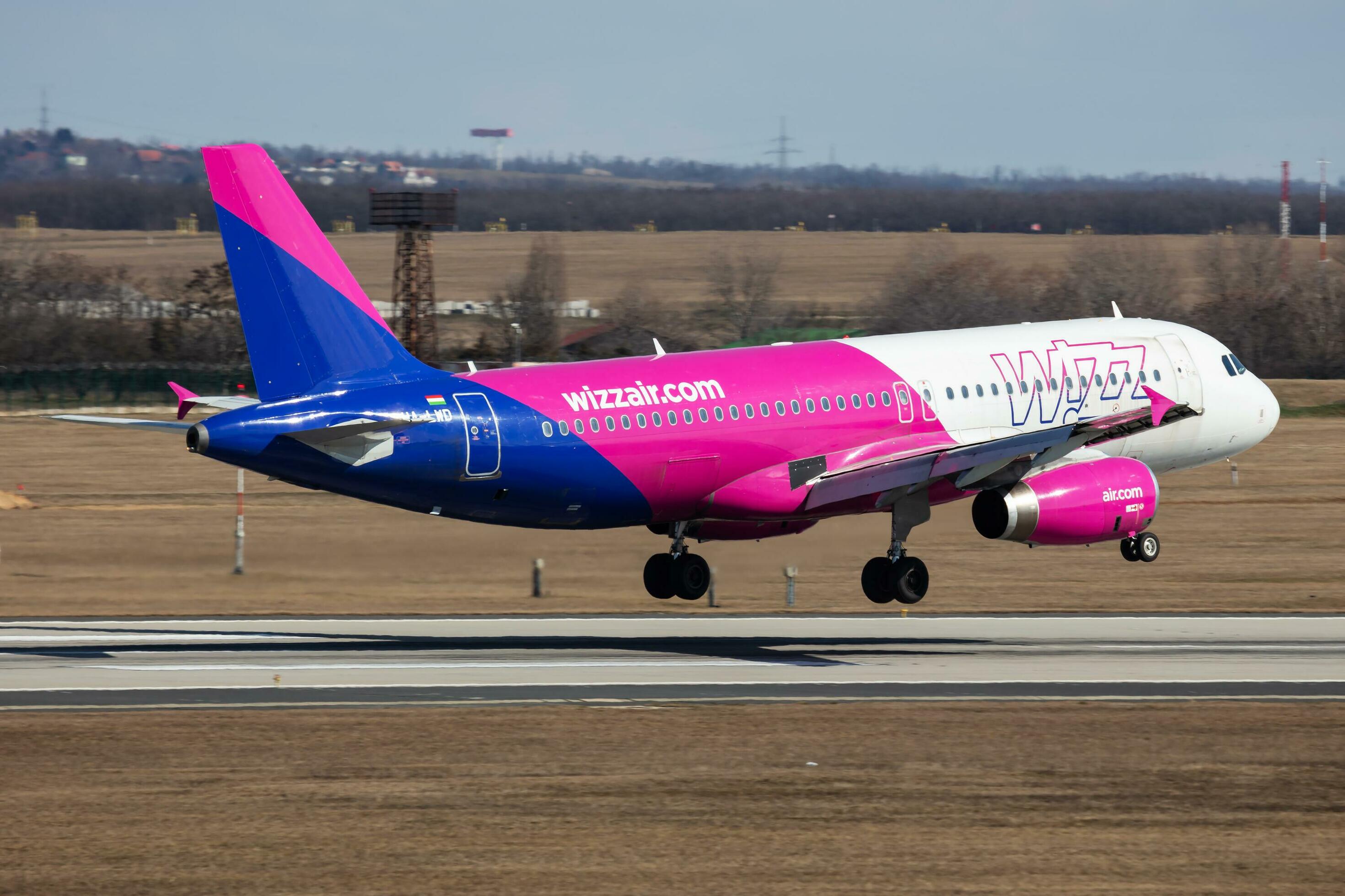 Wizz Air passenger plane at airport. Schedule flight travel. Aviation