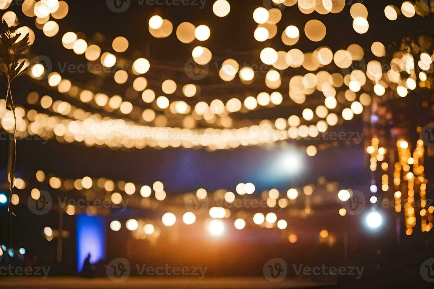 a wedding party is under a string of lights. AI-Generated photo