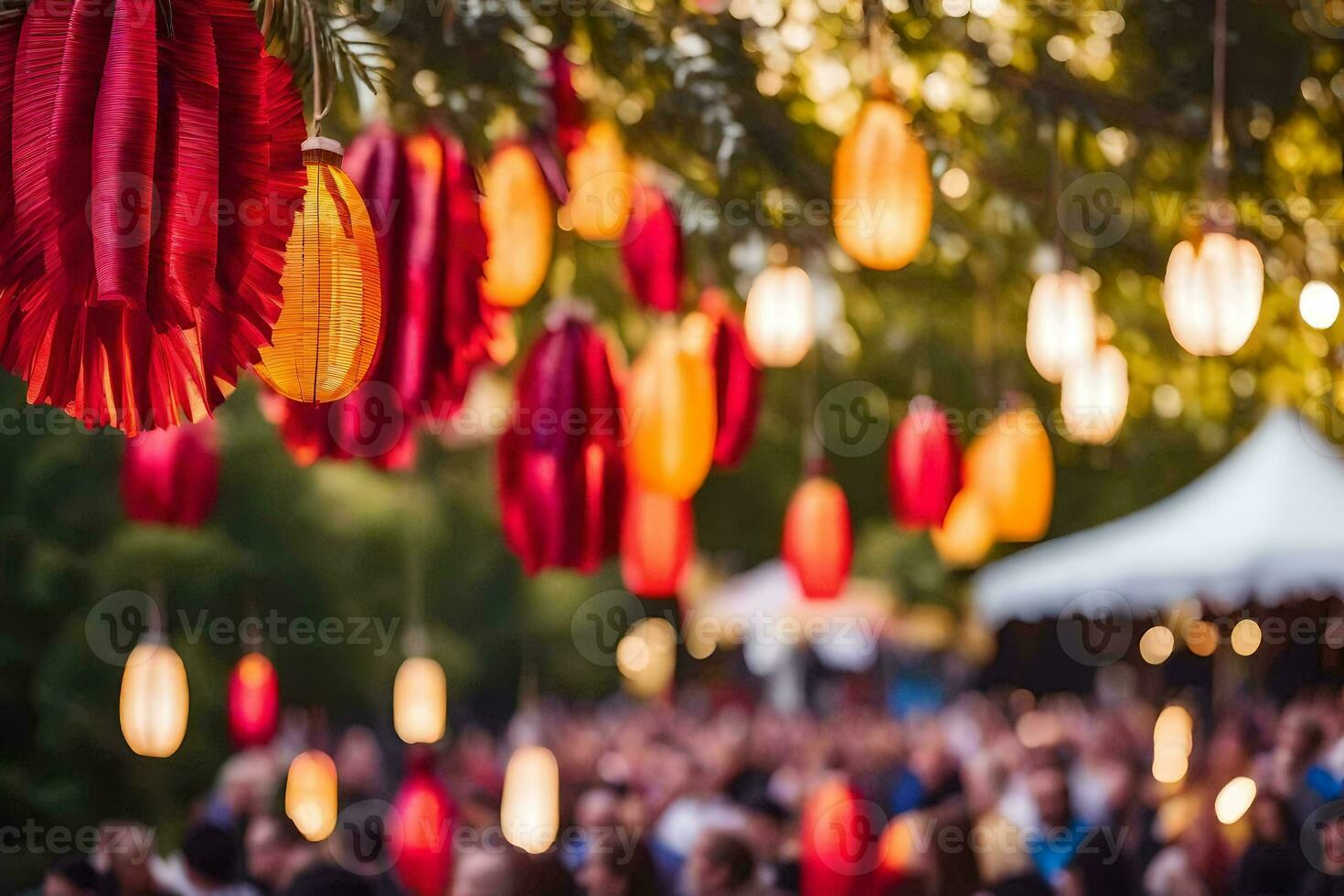 many people are gathered under a tree with paper lanterns. AI-Generated photo