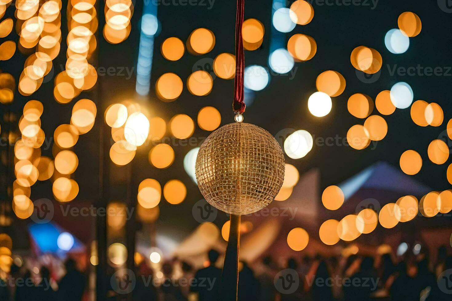 a disco ball is hanging from a pole at night. AI-Generated photo