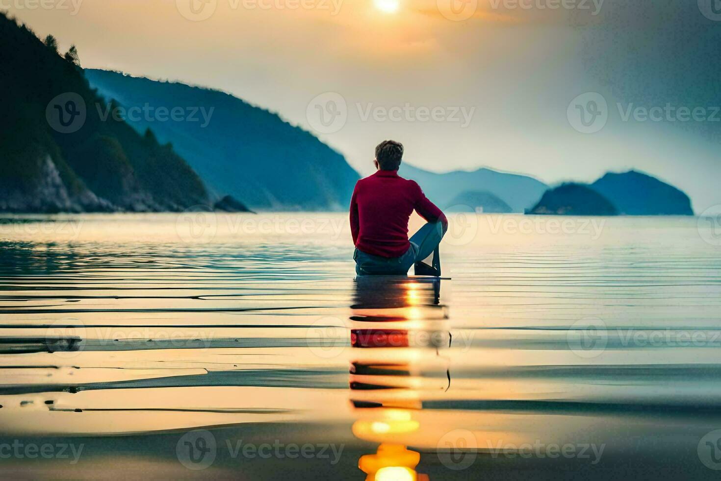 a man sitting on the edge of the water at sunset. AI-Generated photo