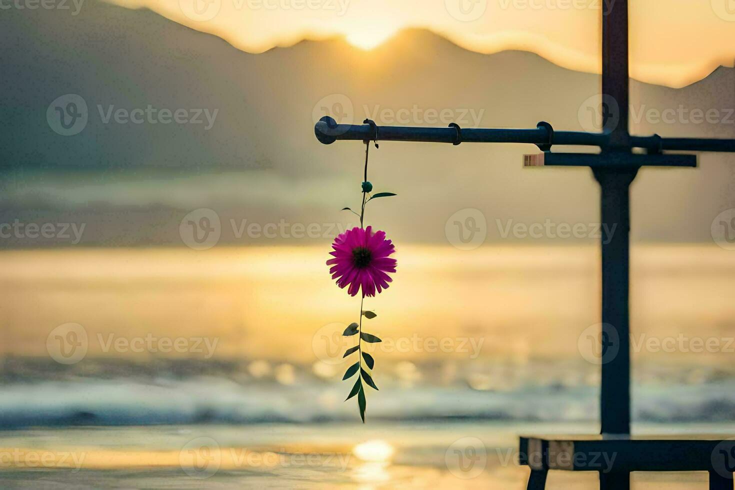 a pink flower hanging from a pole at sunset. AI-Generated photo