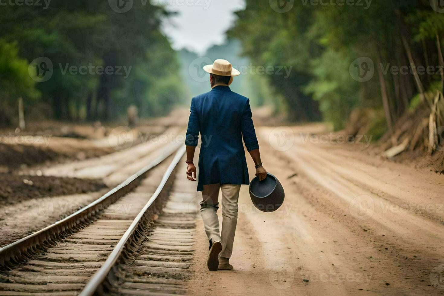 un hombre en un sombrero camina abajo un ferrocarril pista. generado por ai foto