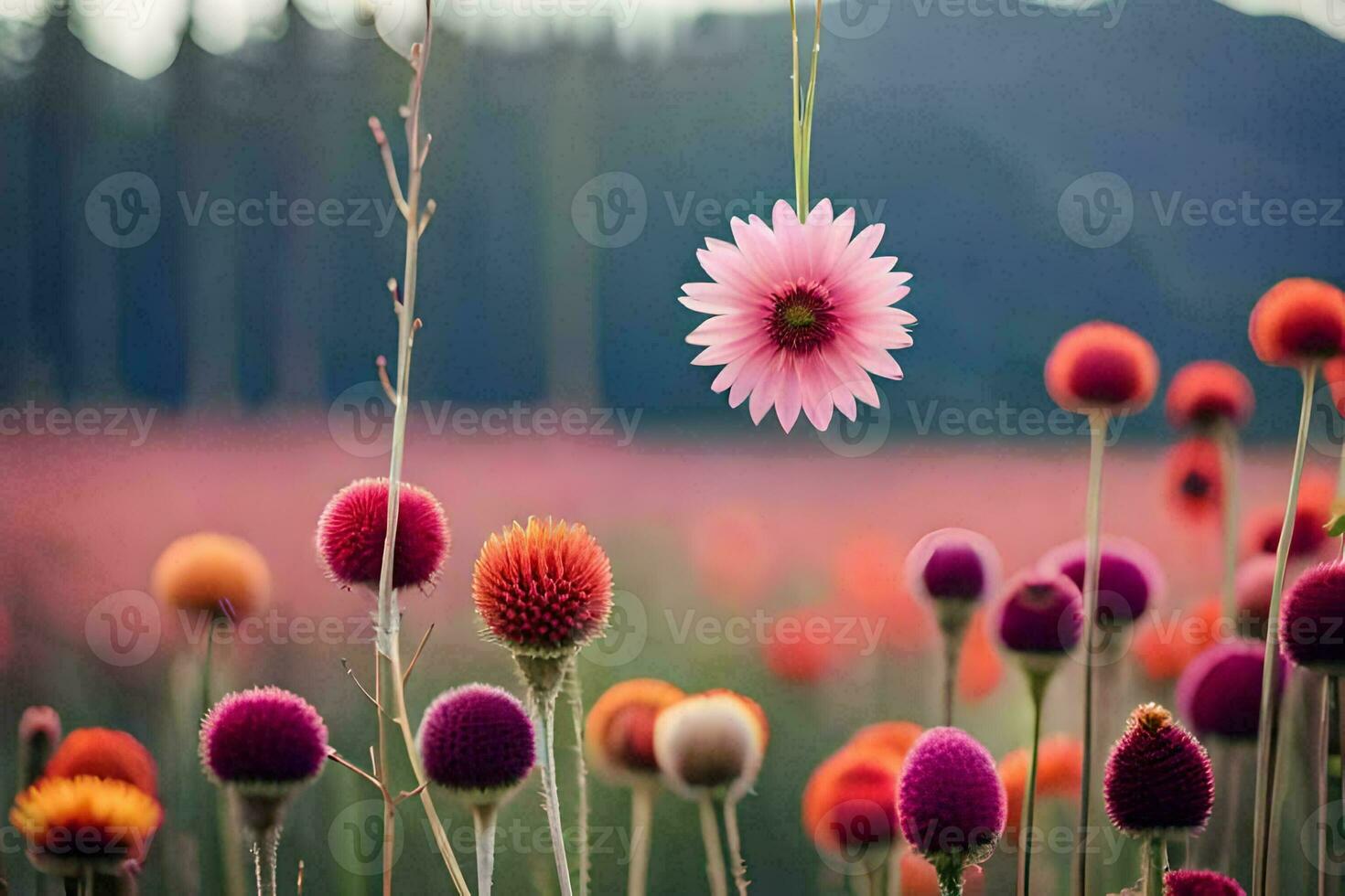 a pink flower is hanging from a string in a field. AI-Generated photo