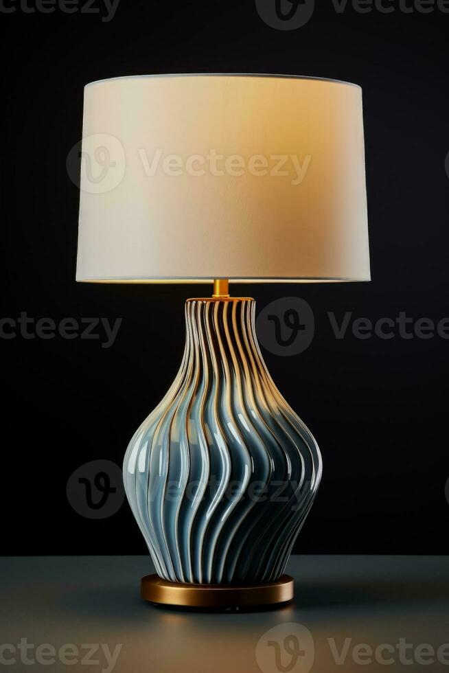 Modern ceramic table lamp on a dark surface background with empty space for text photo