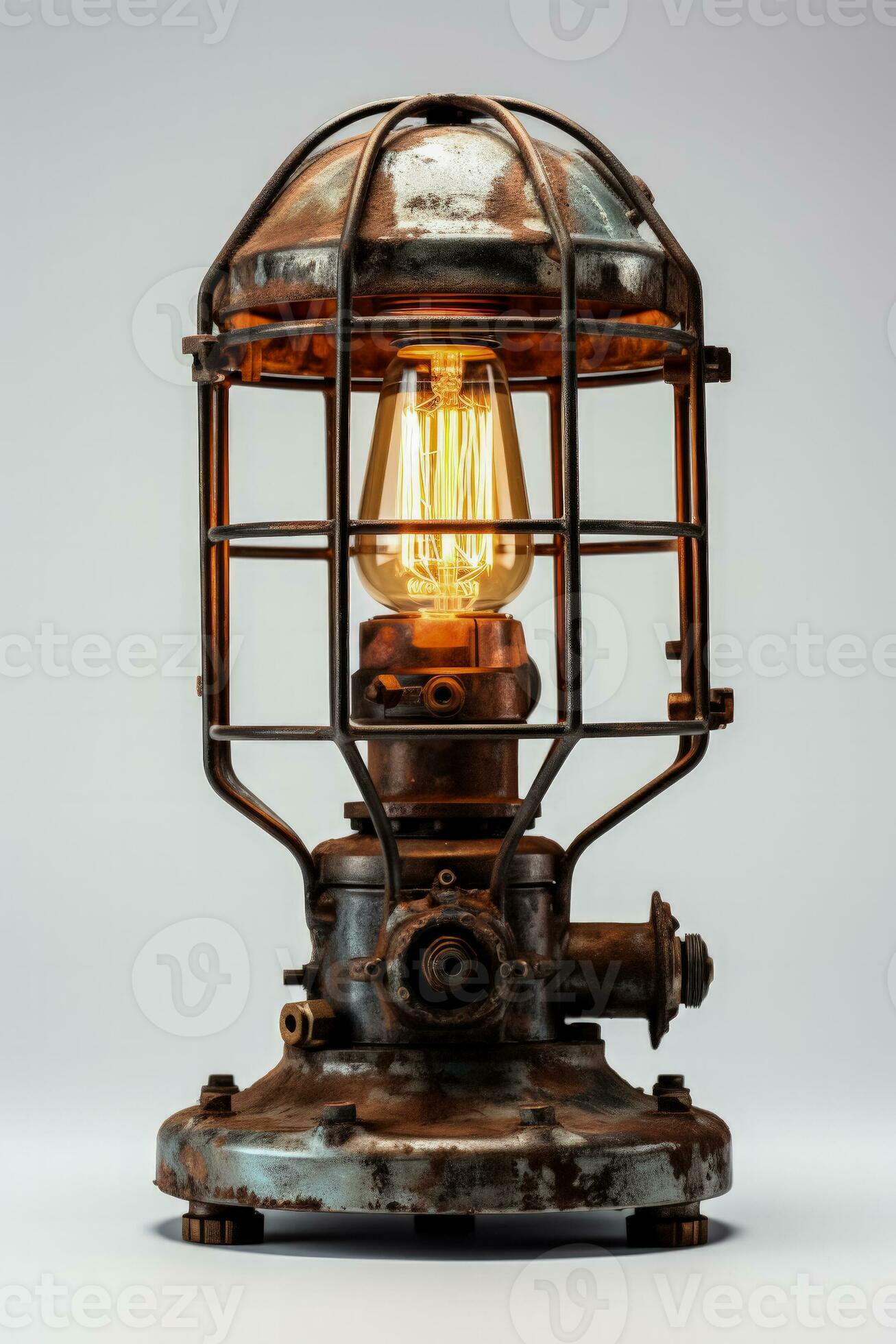 Industrial metal table lamp illuminating brightly isolated on a white