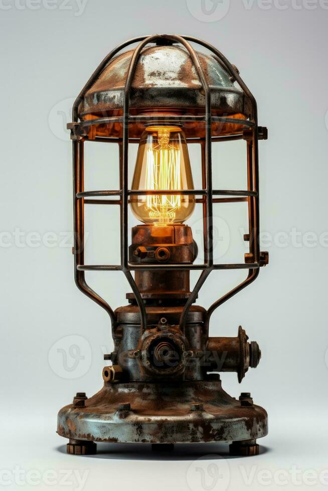 Industrial metal table lamp illuminating brightly isolated on a white background photo