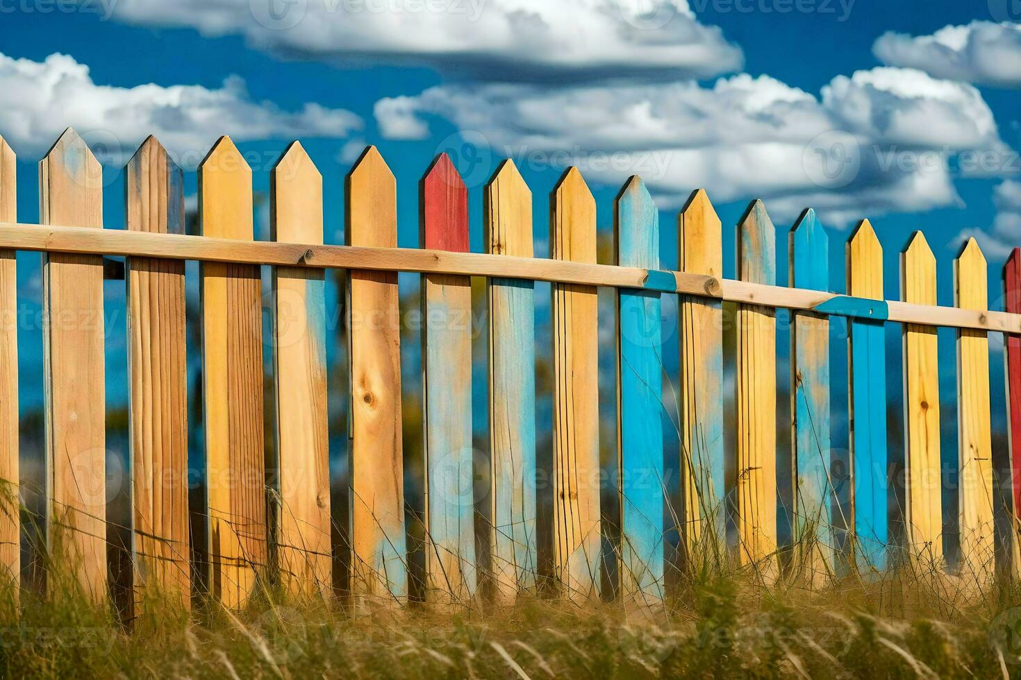 a colorful wooden fence with blue sky and clouds. AI-Generated photo