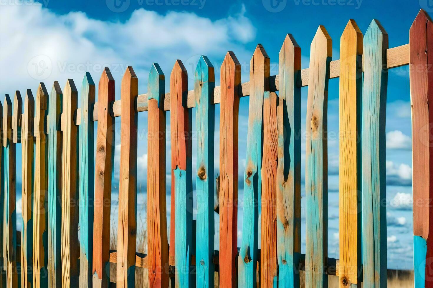 a colorful fence with a blue sky in the background. AI-Generated photo