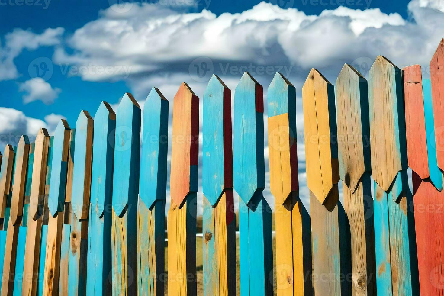 a colorful fence with blue sky and clouds. AI-Generated photo