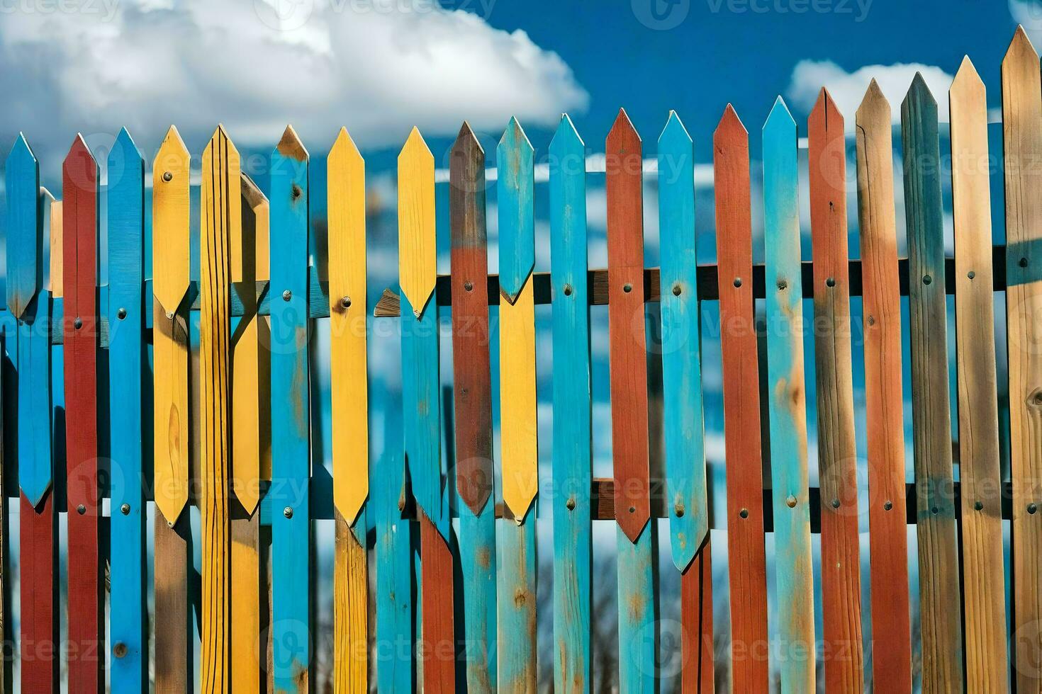 a colorful fence with blue sky in the background. AI-Generated photo