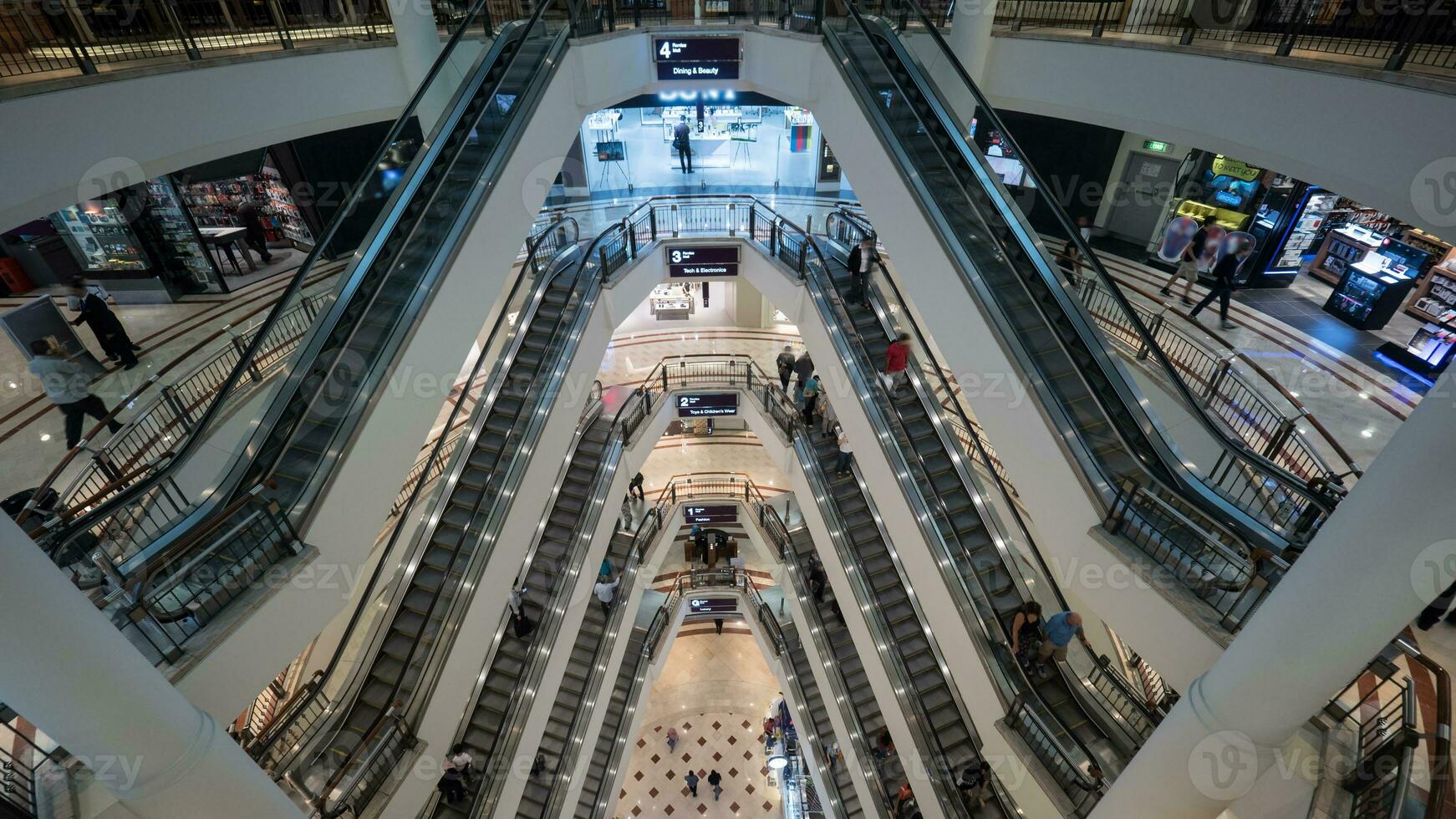 People traffic in multistorey trade centre photo