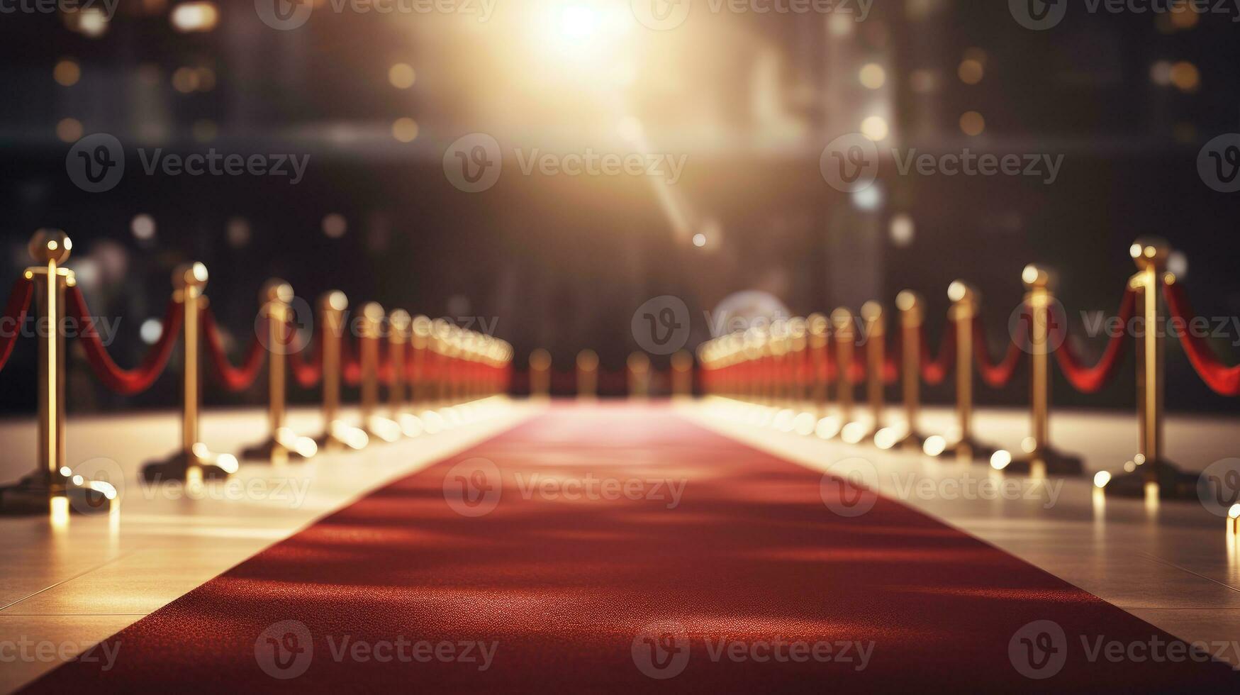 Red carpet and barriers with velvet rope, red curtains in the background and spotlight photo