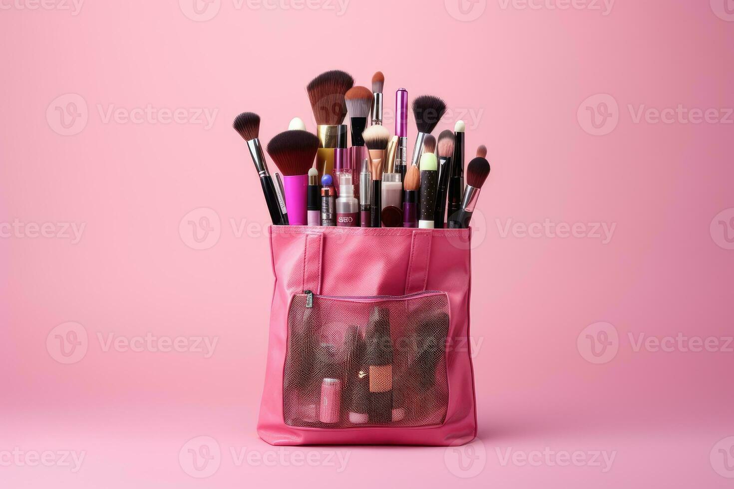 Shopping bag with makeup brushes on pink background, beauty and fashion concept photo