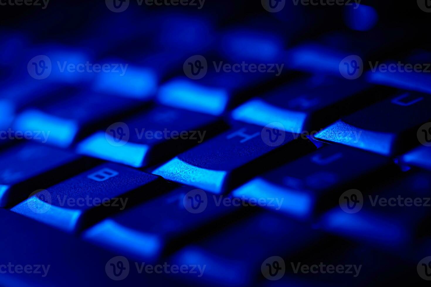Computer keyboard in blue light. photo