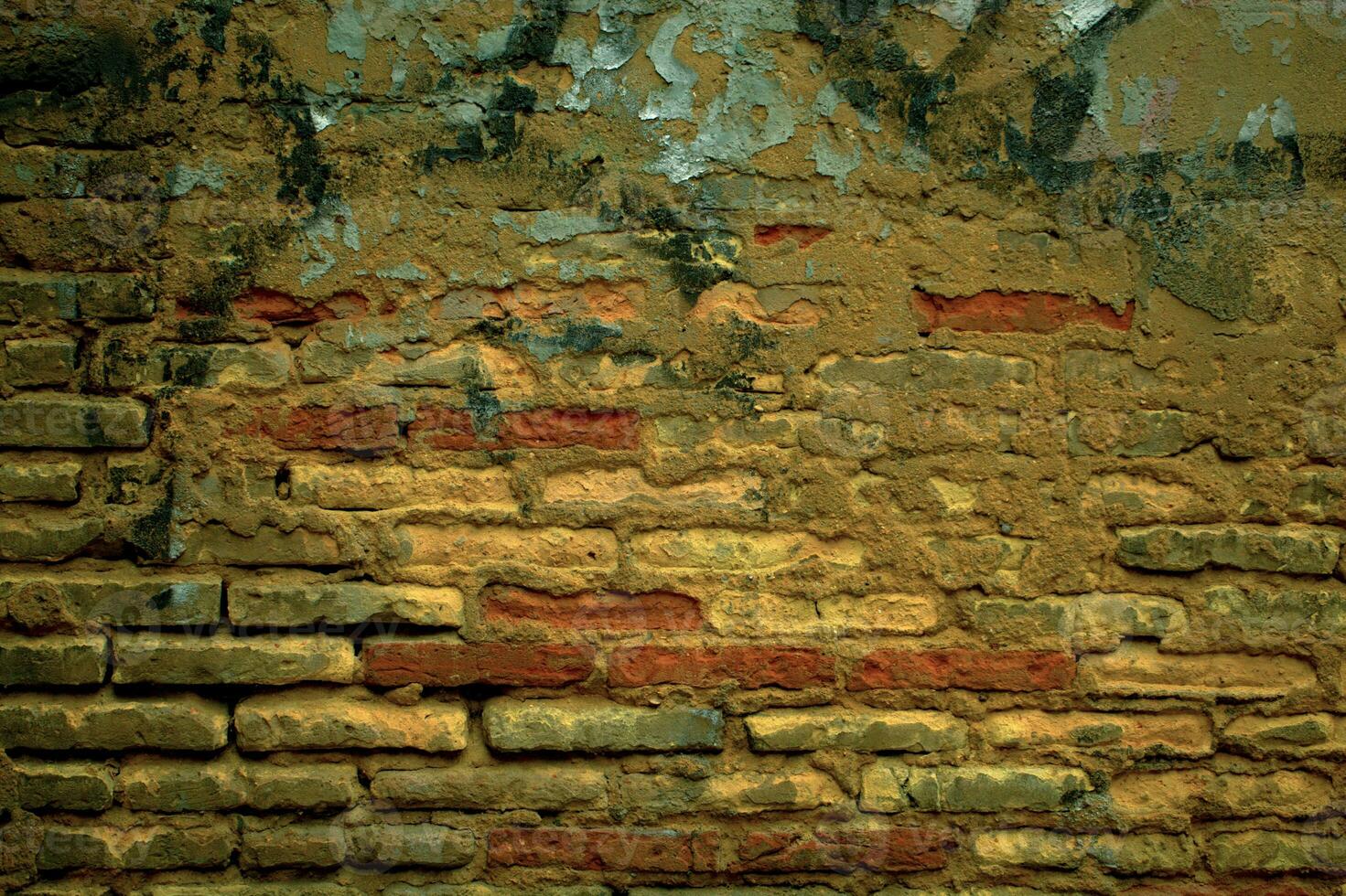 Old grunge weathered brick wall with graffiti photo