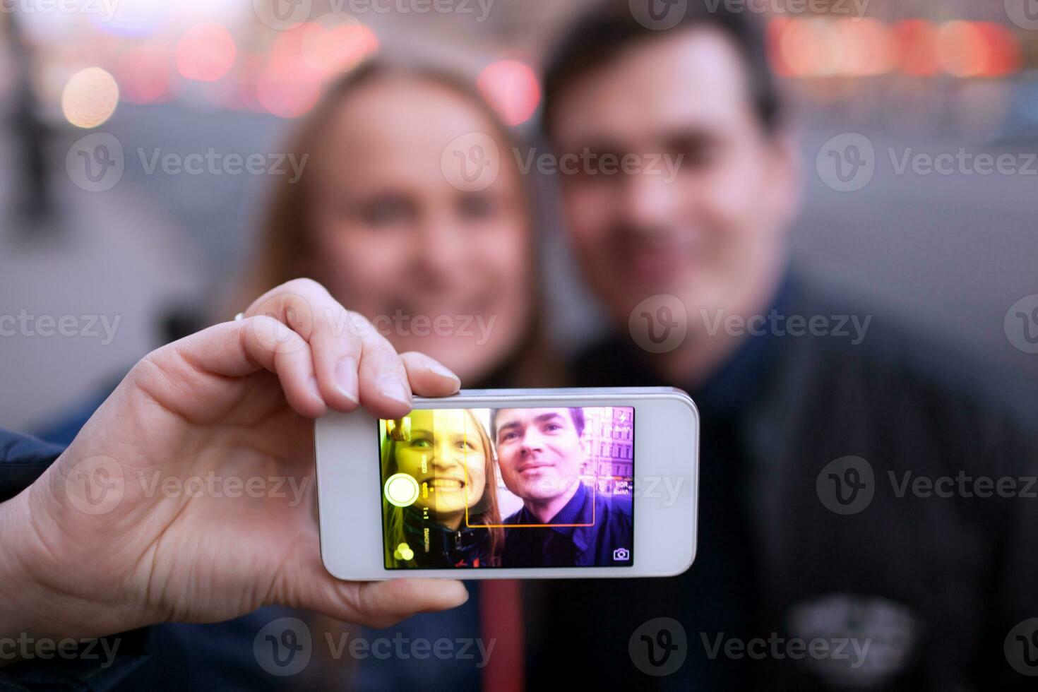 Happy couple taking self portrait photo