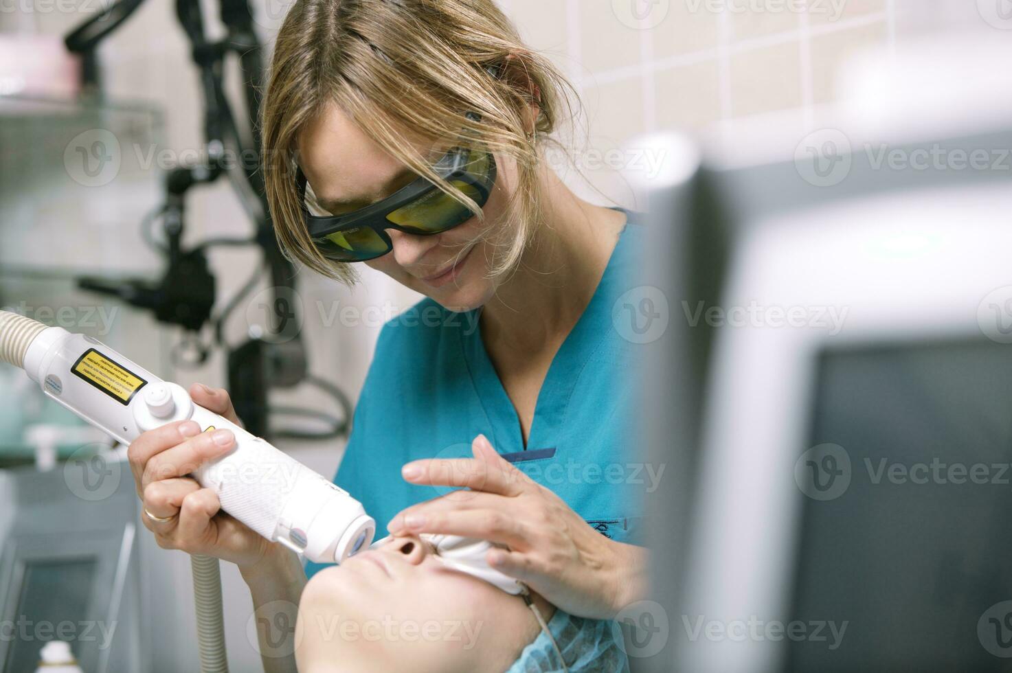 Woman having a laser skin treatment photo