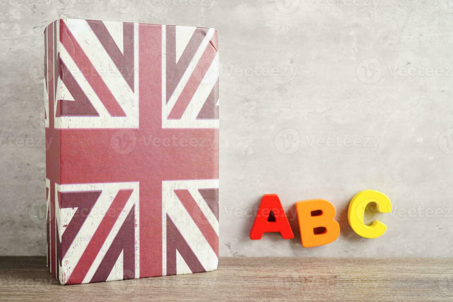 English book with graduate hat, learning and tutorial for foreigner. photo