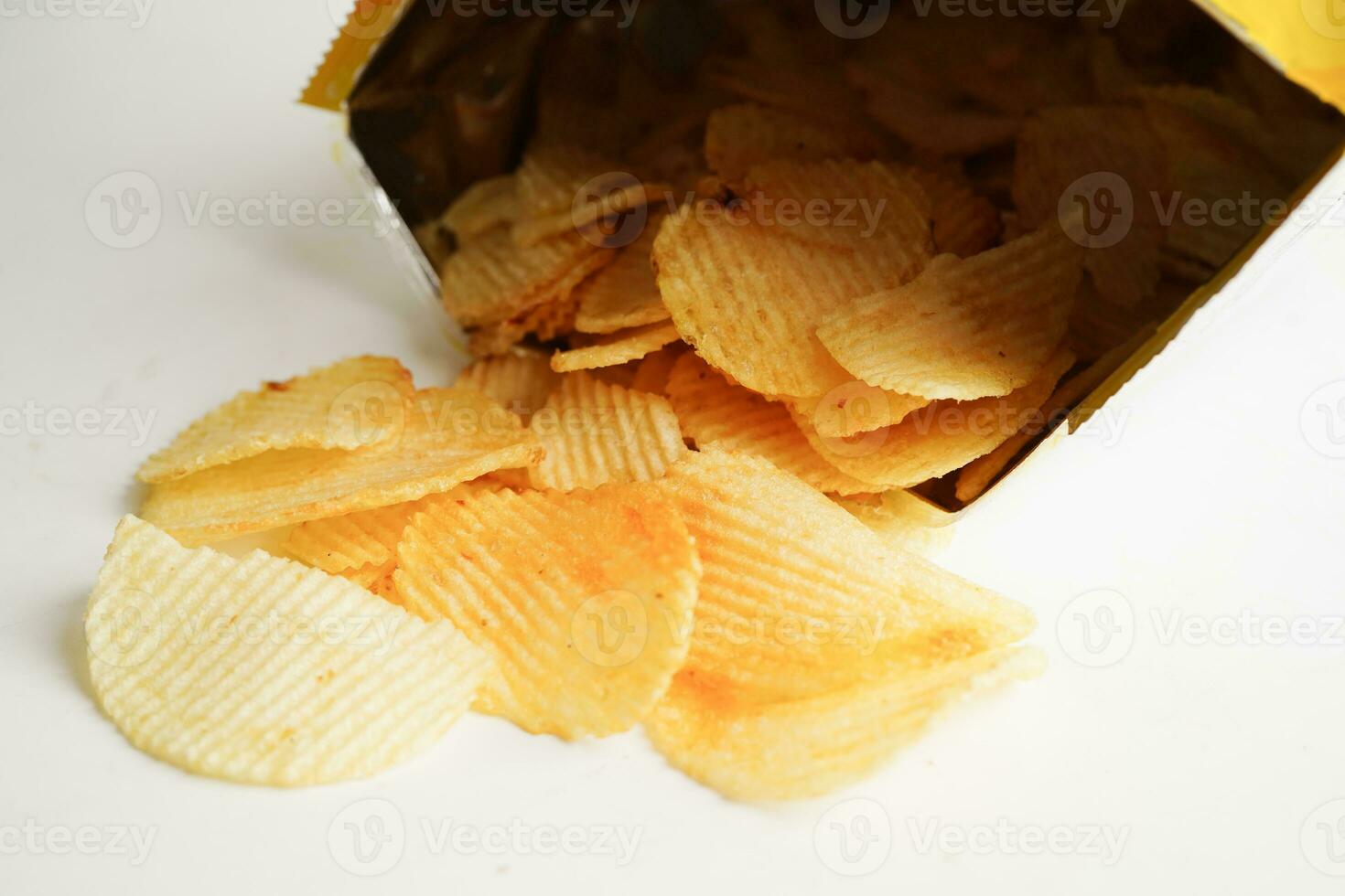 Potato chips in open bag, delicious BBQ seasoning spicy for crips, thin slice deep fried snack fast food. photo