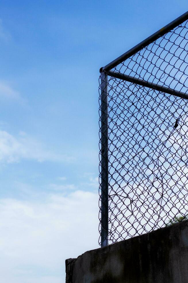 mesh fence with blue sky. photo