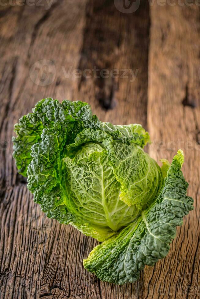 Fresh kale on rustic wooden table. photo