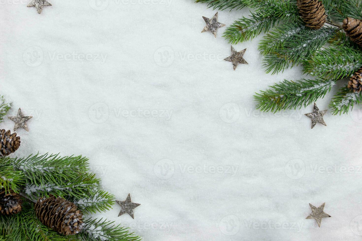 Christmas fir tree branches flat lay with pine cones and decoration on snow background. Creative composition with border. Top view. Copy space. photo