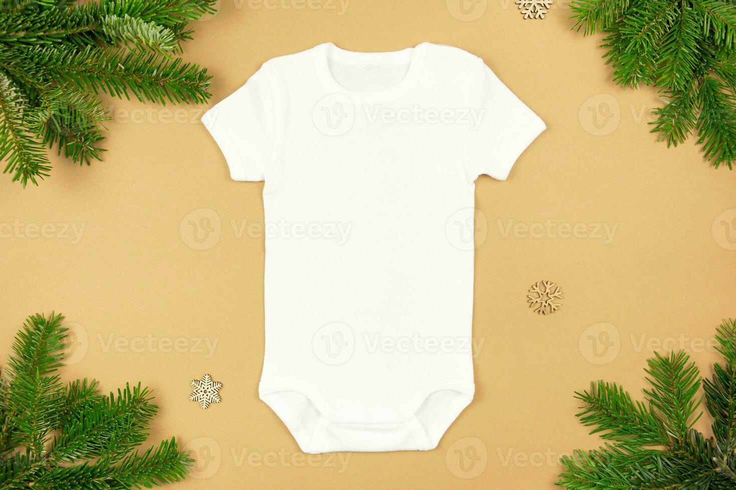 Christmas white baby girl or boy bodysuit mockup flat lay with xmas tree branches and snowflakes decoration on paper background. Design onesie template, print presentation mock up. Top view. photo