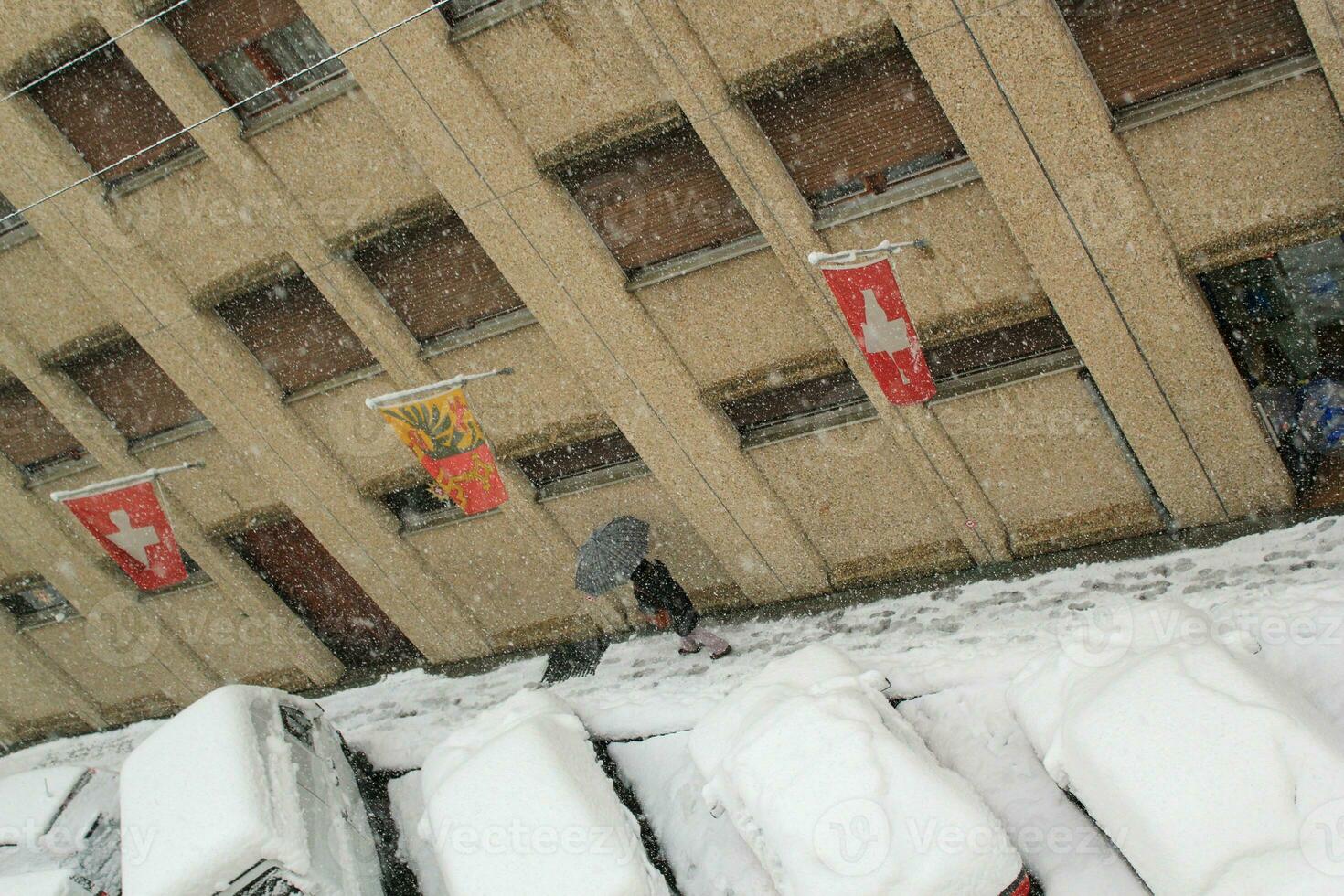 Umbrella in a street by winter photo