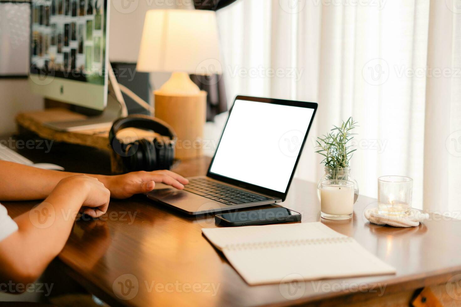 Hands working on laptop computer and internet ,blank screen photo
