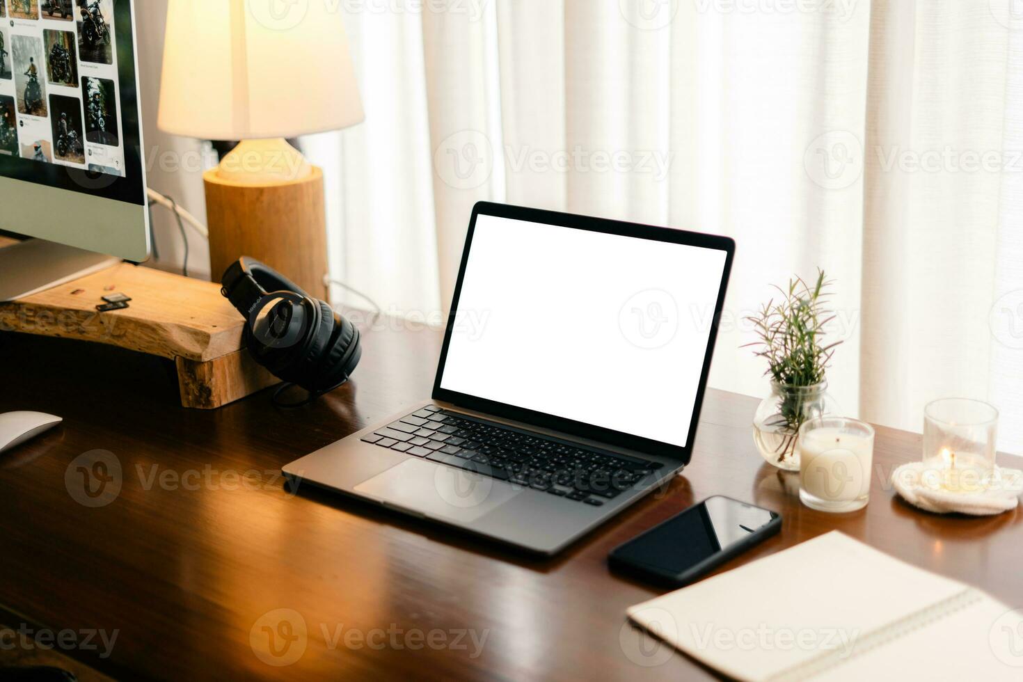 Laptop with blank screen on wooden table photo