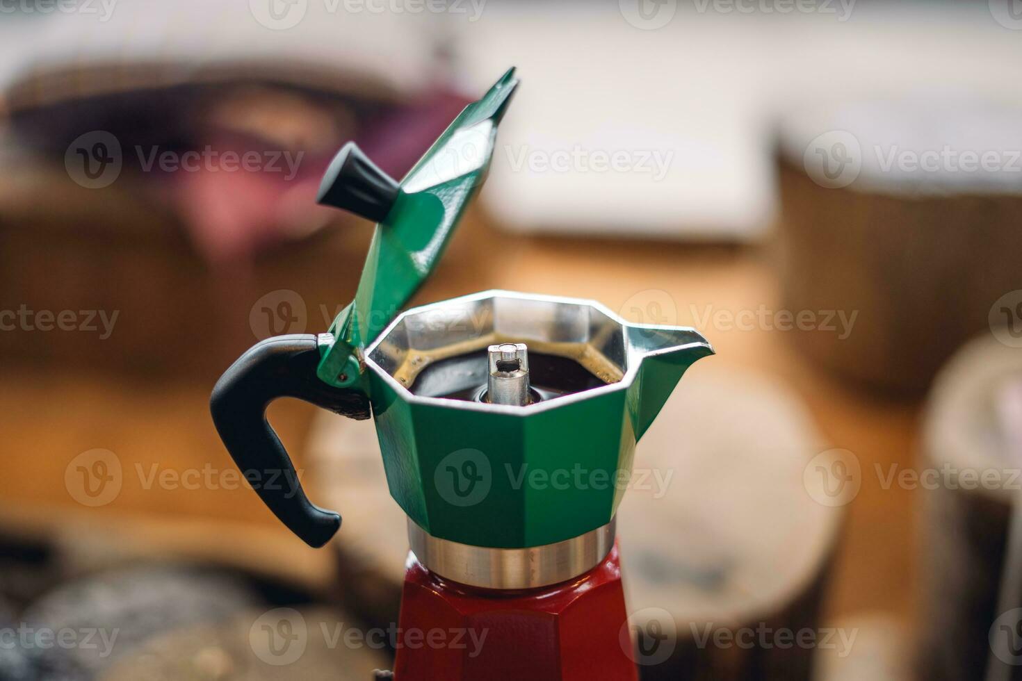 Moka pot coffee on a portable gas stove photo